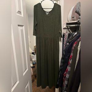 Green long sleeve winter maxi dress with encouraging message on the sleeve